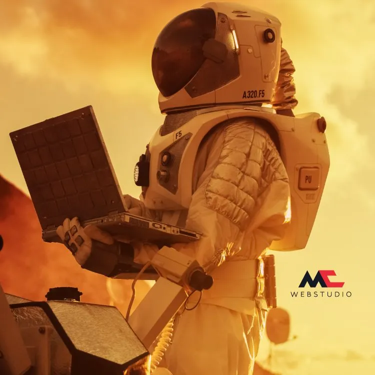 An astronaut fully suited working on a laptop.